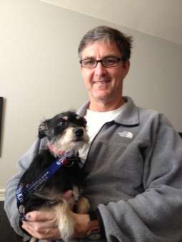 Joe teaches dogs how to behave well in public.