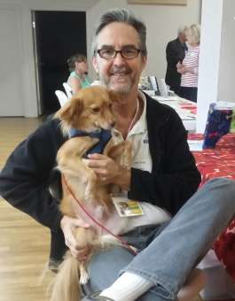 Joe teaches dogs how to behave well in public.