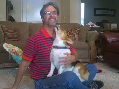 Joe teaches dogs how to behave well in public.