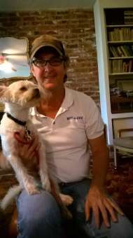 Joe teaches dogs how to behave well in public.