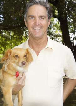 Joe teaches dogs how to behave well in public.